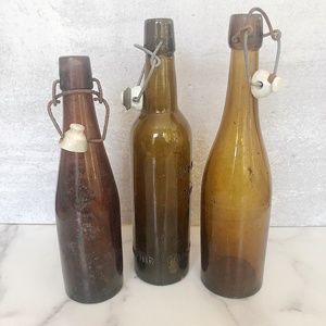 Three vintage glass amber bottles